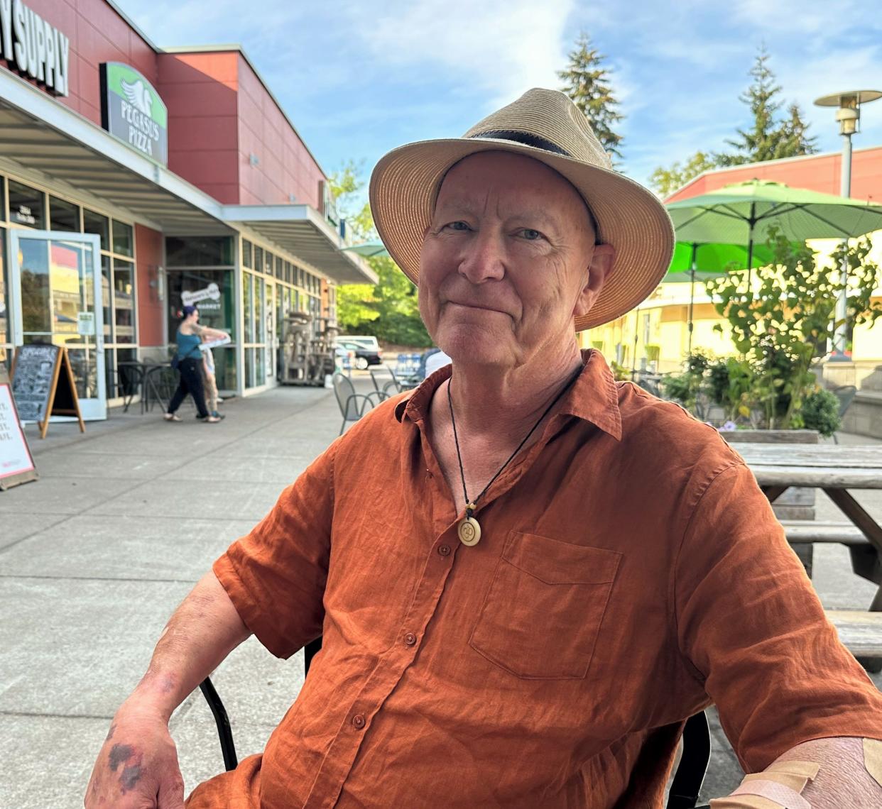 Lea Jones sits on the 16 Tons patio, where his free live music event "Tipping Forward" is happening this weekend.