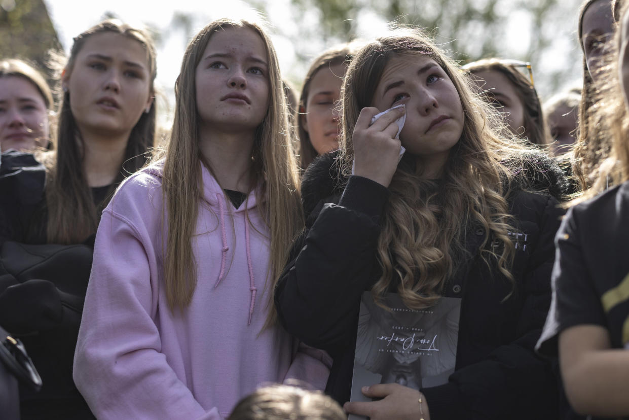 ORPINGTON, ENGLAND - APRIL 20: Fans mourn as they watch the funeral service for Tom Parker on screens outside St Francis of Assisi church on April 20, 2022 in Orpington, England. British singer Tom Parker, a member of popular boy band The Wanted, died at the age of 33 after being diagnosed with an inoperable brain tumour. (Photo by Dan Kitwood/Getty Images)