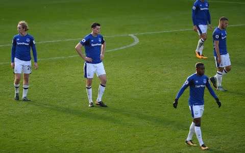Everton's defected players walk back to the centre circle - Credit: Getty images