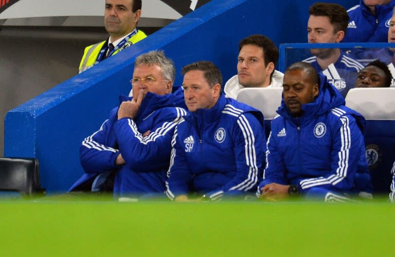 Chelsea manager Guus Hiddink (L) watches his team's English Premier League match against Watford, at Stamford Bridge in London, on December 26, 2015