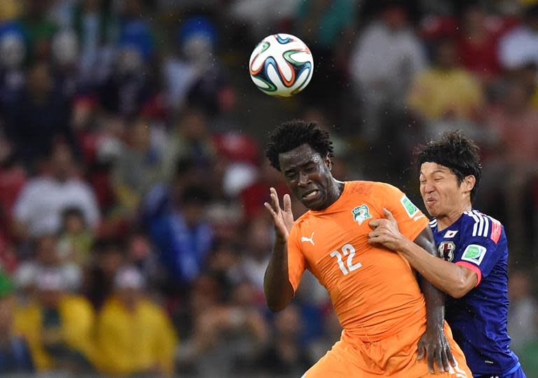 Ivory Coast's Wilfried Bony heads the ball during their Group C match against Japan, at the Pernambuco Arena in Recife, during the FIFA World Cup, on June 14, 2014