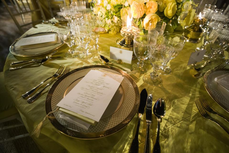 A table is set during a media preview for the State Dinner with President Donald Trump and Australian Prime Minister Scott Morrison in the Rose Garden of the White House, Thursday, Sept. 19, 2019, in Washington. (AP Photo/Alex Brandon)