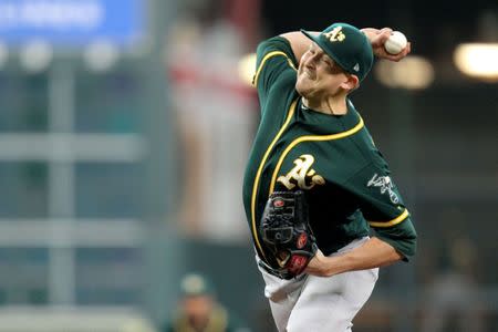 Jul 12, 2018; Houston, TX, USA; Oakland Athletics starting pitcher Trevor Cahill (53) delivers a pitch against the Houston Astros during the first inning during the first inning at Minute Maid Park. Mandatory Credit: Erik Williams-USA TODAY Sports