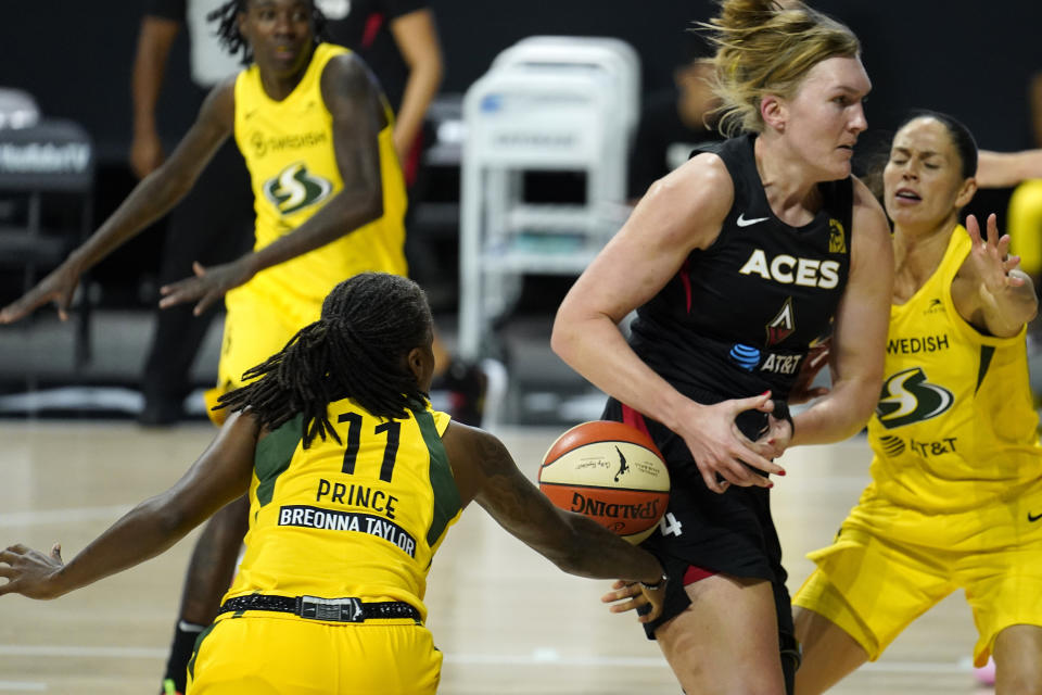 Seattle Storm guard Epiphanny Prince (11) stripes the ball from Las Vegas Aces center Carolyn Swords (4) during the first half of Game 1 of basketball's WNBA Finals Friday, Oct. 2, 2020, in Bradenton, Fla. (AP Photo/Chris O'Meara)