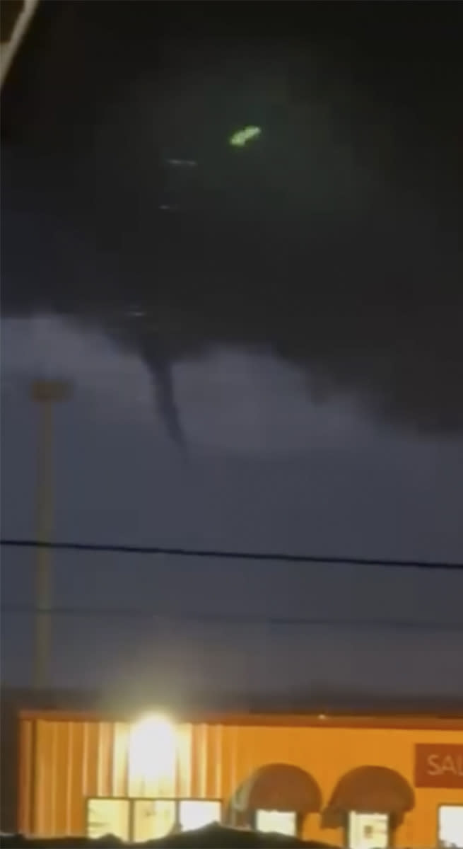 A funnel cloud is seen in the sky over Evansville, Wis., on Thursday, Feb. 8, 2024. The first-ever February tornado for the state of Wisconsin was spotted Thursday just south of Madison, the National Weather Service confirmed. (Kristofer Bell via AP)