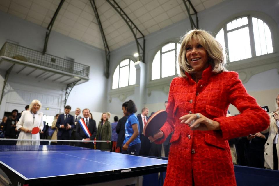 Camilla and the French first lady bonded over a game of table tennis at a community centre in Saint-Denis, northern Paris (PA)