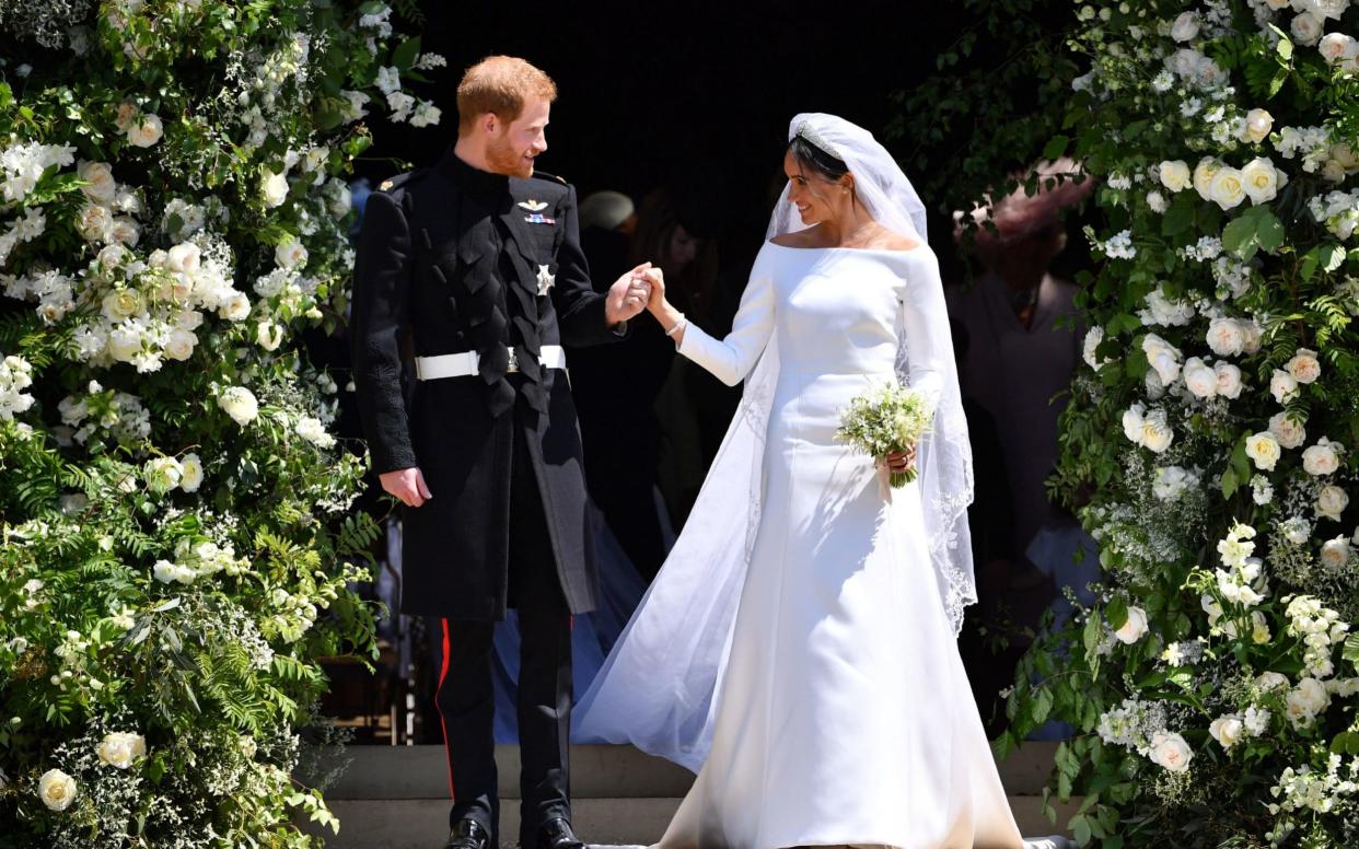 The new Duke and Duchess of Sussex leave St George's Chapel, Windsor on the wedding day - PA