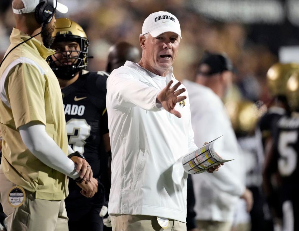 Colorado offensive coordinator Pat Shurmur gestures in the second half of an NCAA college football game against Colorado State, Sept. 16, 2023, in Boulder, Colo. (AP Photo/David Zalubowski, File)