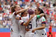 Megan Rapinoe of the USA celebrates with her team mates after scoring her sides first goal from the penalty spot during the 2019 FIFA Women's World Cup France Round Of 16 match between Spain and USA at Stade Auguste Delaune on June 24, 2019 in Reims, France. (Photo by Robert Cianflone/Getty Images)