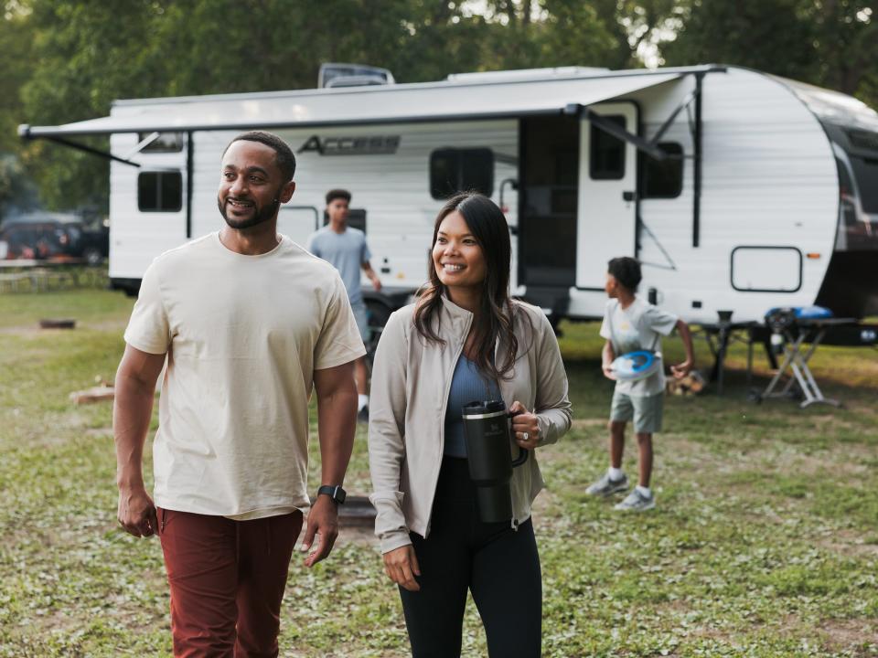 People walking next to Winnebago's new Access RV