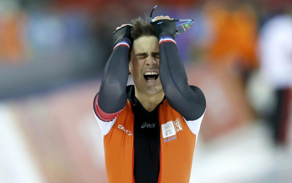 Jan Smeekens of the Netherlands reacts after his race two of the men's 500 meters speed skating event during the 2014 Sochi Winter Olympics, February 10, 2014. REUTERS/Issei Kato (RUSSIA - Tags: OLYMPICS SPORT SPEED SKATING)