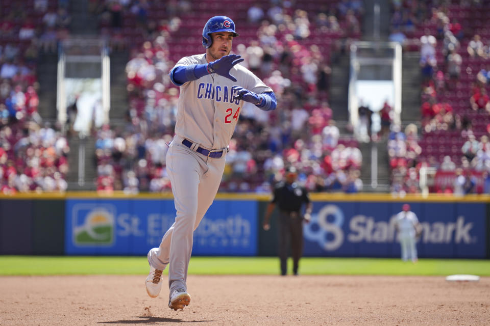 Chicago Cubs' Cody Bellinger gestures to the dugout as he runs the bases after hitting a solo home run during the fourth inning of the first game of a baseball double header against the Cincinnati Reds in Cincinnati, Friday, Sep. 1, 2023. (AP Photo/Aaron Doster)