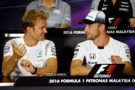 Formula One - F1 - Malaysia Grand Prix - Sepang, Malaysia- 29/9/16. McLaren's Jenson Button of Britain and Mercedes' Nico Rosberg of Germany speak during news conference. REUTERS/Edgar Su