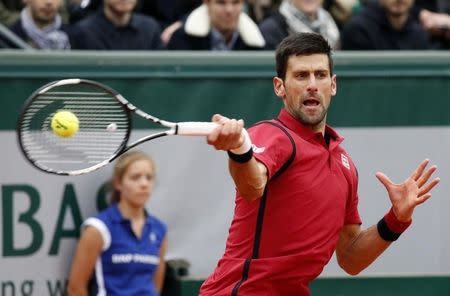 Tennis - French Open Mens Singles Semifinal match - Roland Garros - Novak Djokovic of Serbia v Dominic Thiem of Austria - Paris, France - 03/06/16. Novak Djokovic returns a shot. REUTERS/Jacky Naegelen