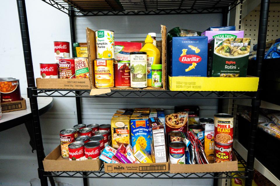 Rows of canned and dried food are seen at IMPACT food pantry in the Drake neighborhood on Tuesday, August 1, 2023 in Des Moines.