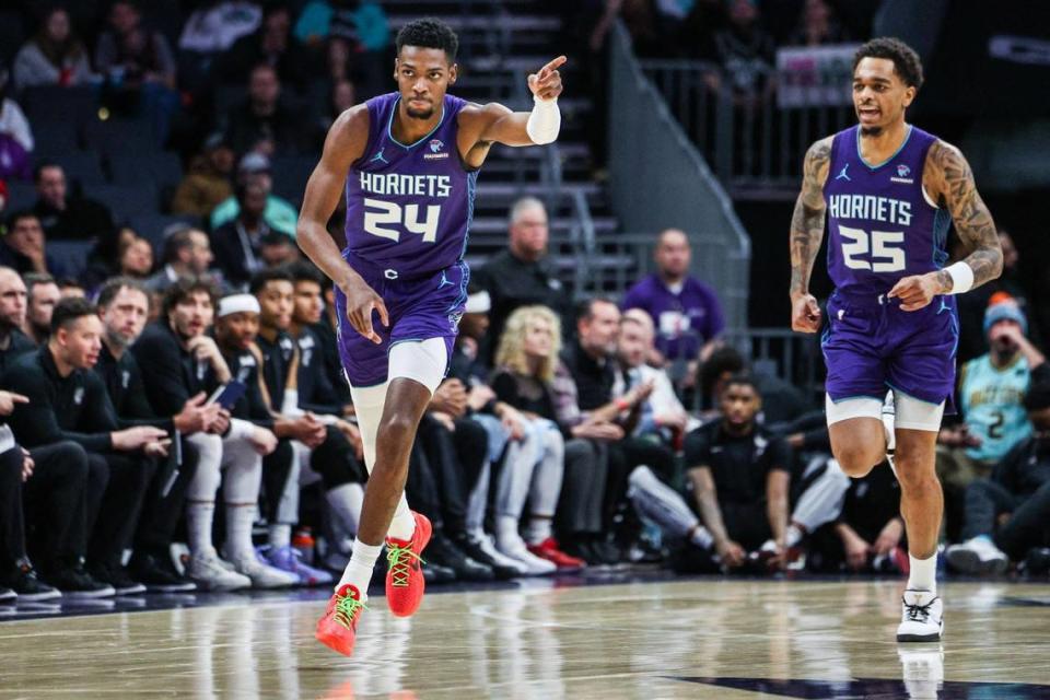 Hornets guard Brandon Miller, left, points after making a three-point shot during the game against the Spurs at Spectrum Center on Friday, January 19, 2024. Miller scored 24 points in the Hornets’ 124-120 win.