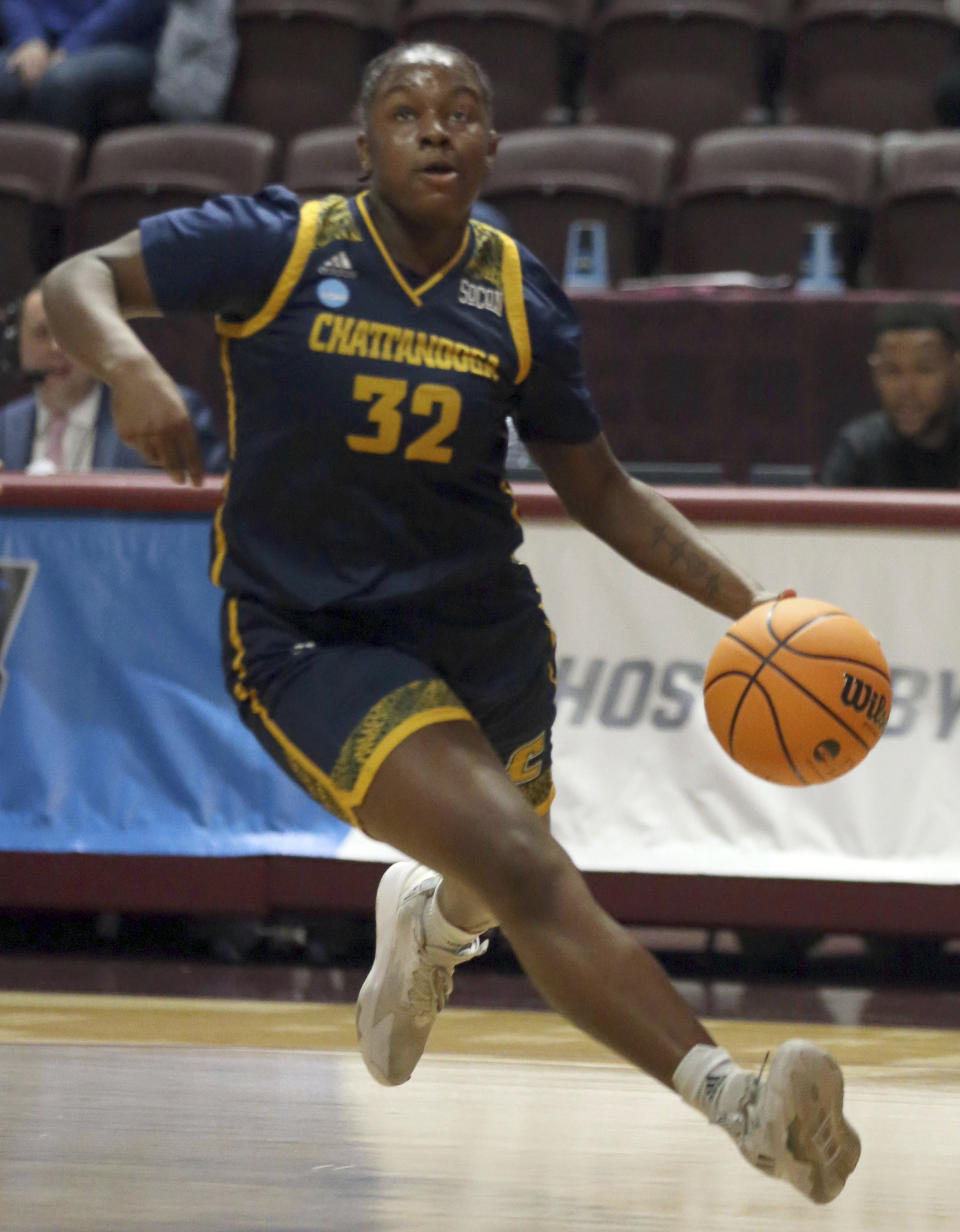 Chattanooga's Raven Thompson drives against Virginia Tech during the first quarter of a first-round college basketball game in the women's NCAA Tournament, Friday, March 17, 2023, in Blacksburg, Va. (Matt Gentry/The Roanoke Times via AP)