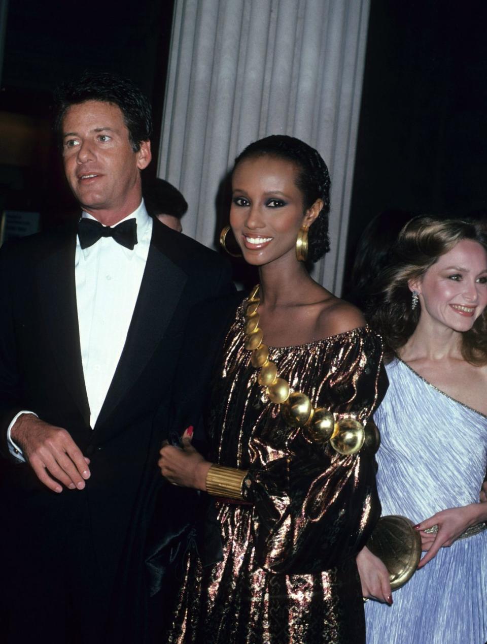 <p>Supermodel Iman accompanied Calvin Klein to the Met Gala wearing a shimmering gold gown he designed. </p>