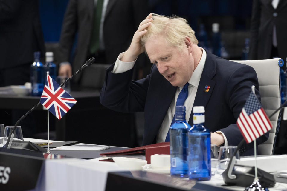 British Prime Minister Boris Johnson gestures at the start of the second plenary session of the NATO summit in Madrid, Wednesday, June 29, 2022. North Atlantic Treaty Organization heads of state will meet for a NATO summit in Madrid from Tuesday through Thursday. (Eliot Blondet, Pool via AP)