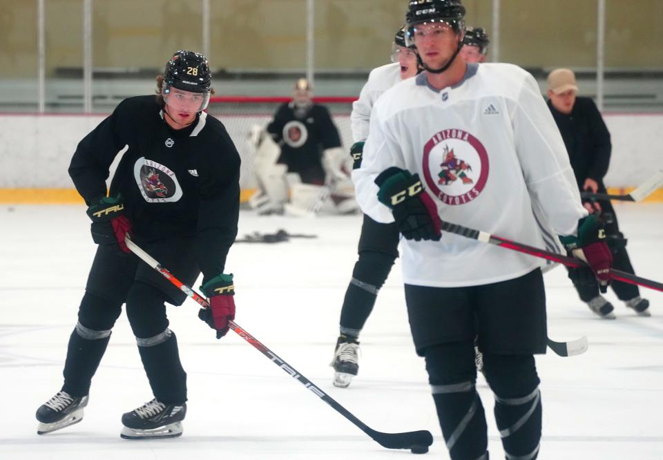 Conor Geekie (left) skates in his first rookie camp with the Arizona Coyotes on Wednesday at Scottsdale Ice Den. Patrick Breen/The Republic