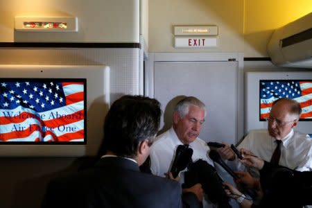 U.S. Secretary of State Rex Tillerson speaks to reporters en route with President Donald Trump to a NATO summit in Brussels aboard Air Force One May 24, 2017.  REUTERS/Jonathan Ernst