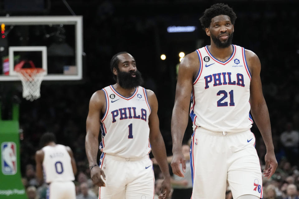 Philadelphia 76ers center Joel Embiid (21) smiles while walking down court with James Harden (1) during the second half of Game 5 in the NBA basketball Eastern Conference semifinals playoff series against the Boston Celtics, Tuesday, May 9, 2023, in Boston. (AP Photo/Charles Krupa)