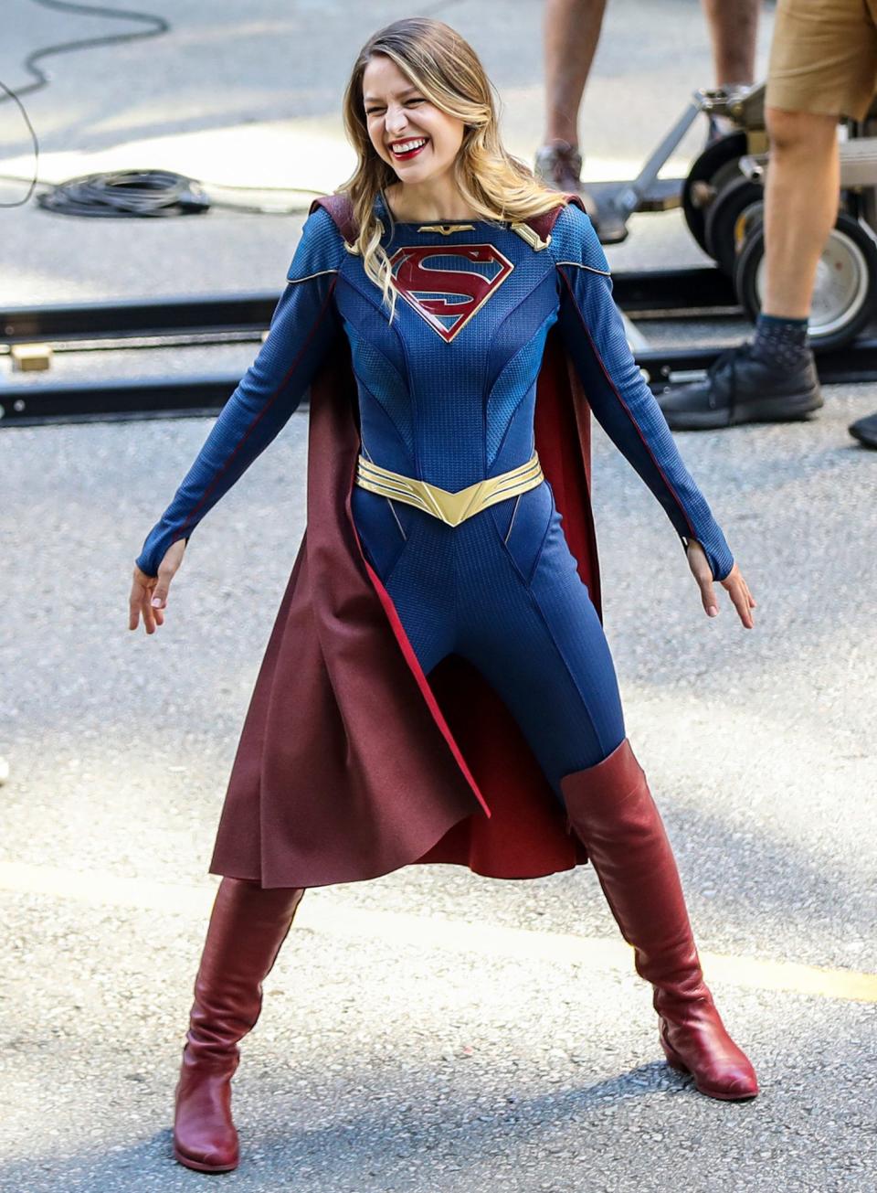 <p>Melissa Benoist goofs off in full costume on the set of <em>Supergirl</em> in Vancouver.</p>