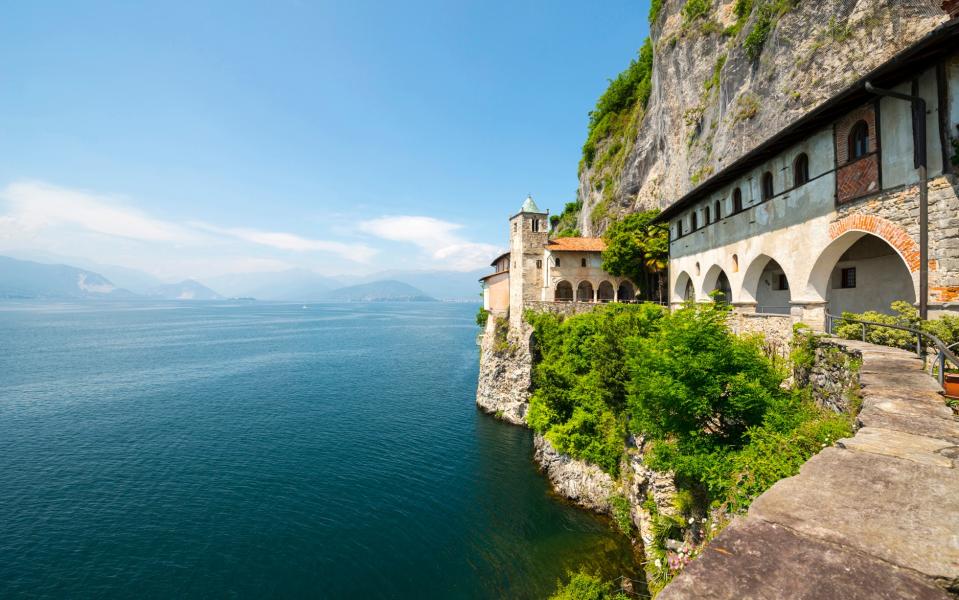 Carved from a rock face, Santa Caterina del Sasso is only visible from the water and is particularly beautiful at sunset, Italian Lakes