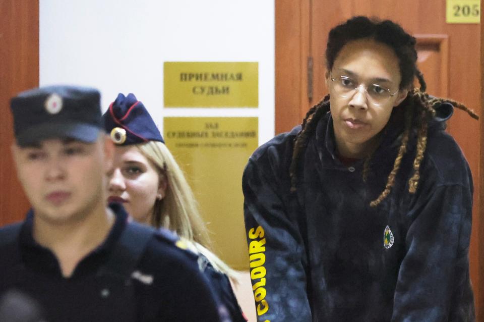 WNBA star and two-time Olympic gold medalist Brittney Griner is escorted to a courtroom for a hearing, in Khimki just outside Moscow, Russia, Monday, July 25, 2022.