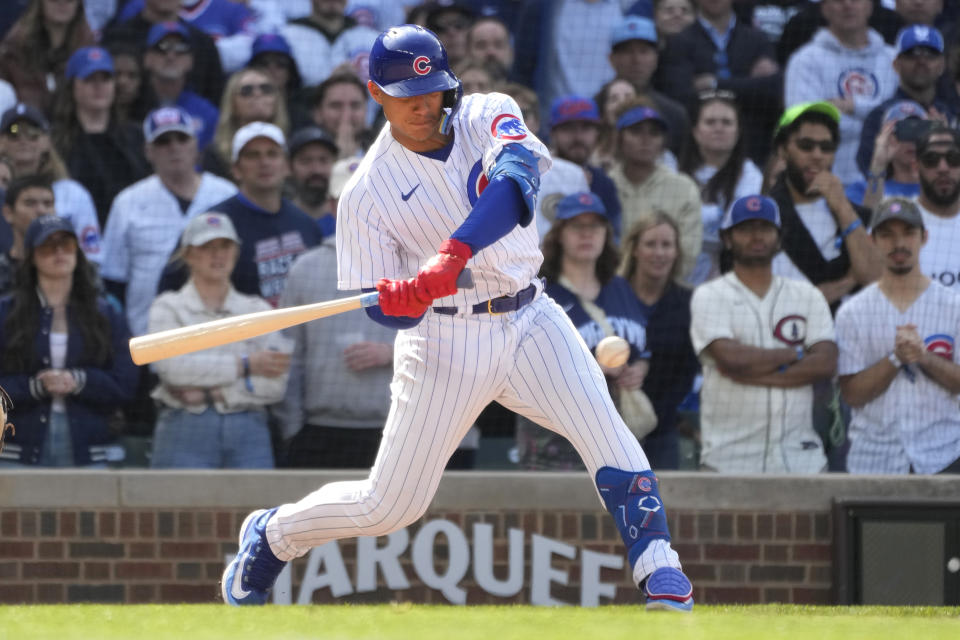 Chicago Cubs' Miguel Amaya swings into a pinch-hit RBI single, in his first major league at bat, during the eighth inning of a baseball game against the Miami Marlins on Saturday, May 6, 2023, in Chicago. (AP Photo/Charles Rex Arbogast)