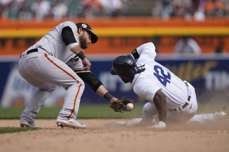 Detroit Tigers' Akil Baddoo beats the tag of San Francisco Giants shortstop Brandon Crawford and steals second during the eighth inning of a baseball game, Saturday, April 15, 2023, in Detroit. (AP Photo/Carlos Osorio)
