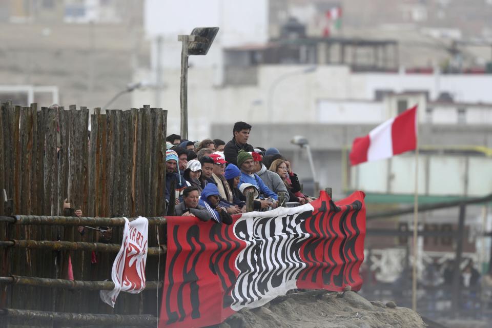 Surfing fans watch the competition during the Pan American Games on Punta Rocas beach in Lima Peru, Sunday, Aug. 4, 2019. (AP Photo/Martin Mejia)