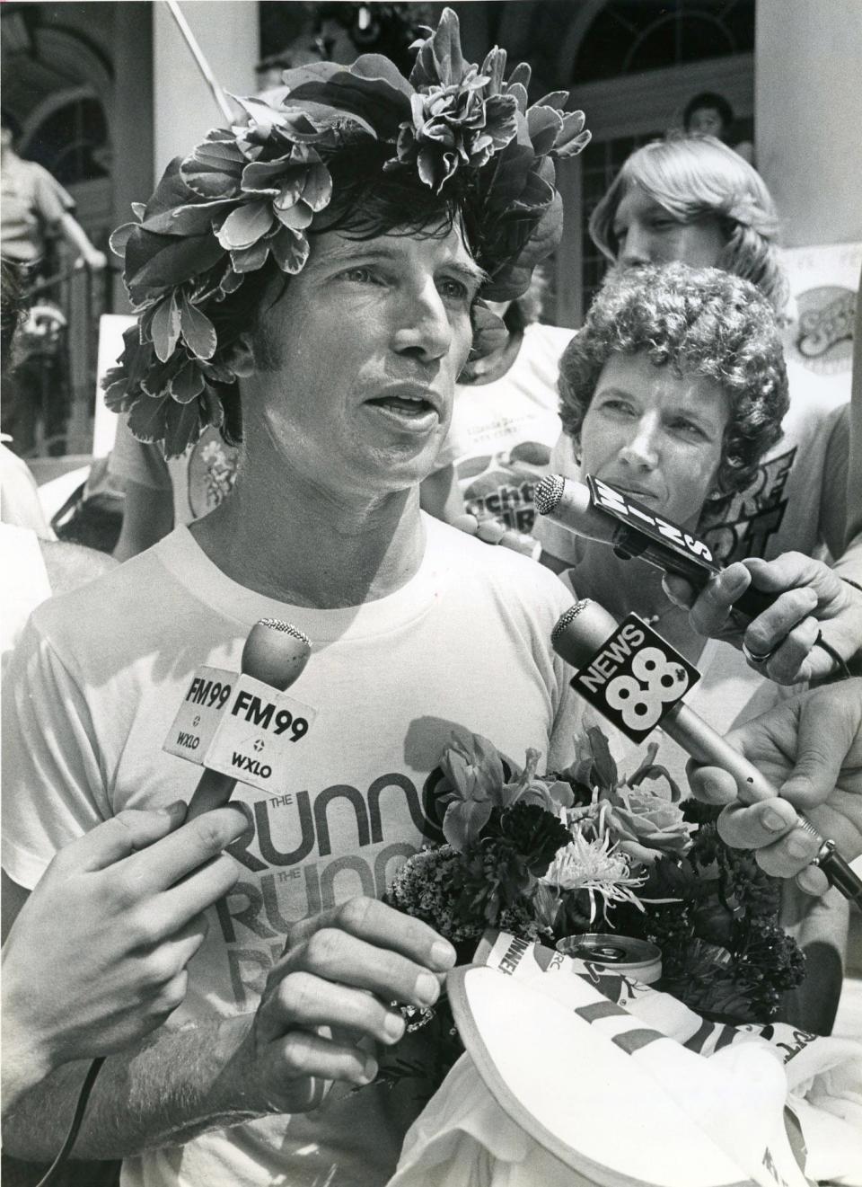 Jay Birmingham talks with reporters on the steps of the New York City Hall in 1980 after running across America, covering 2,964 miles in 71 days, 22 hours, 59 minutes to break the national record for a solo, unsupported cross-country run. Saturday, he is scheduled to play music in San Marco with two other longtime runners.