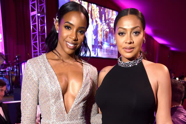 <p>Dimitrios Kambouris/Getty</p> Kelly Rowland and La La Anthony pose together at the 24th Annual Elton John AIDS Foundation's Oscar Viewing Party in 2016