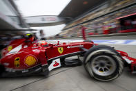 Ferrari driver Kimi Raikkonen of Finland drives out from the garage during the practice session ahead of Sunday's Chinese Formula One Grand Prix at Shanghai International Circuit in Shanghai, China Friday, April 18, 2014. (AP Photo/Andy Wong)