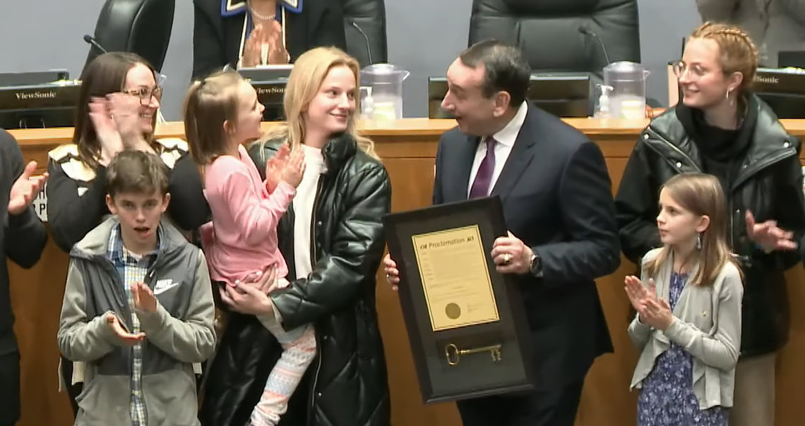 Coach Mike Krzyzewski, surrounded by family, accepted the key to the city at Durham City Hall on December 19, 2022.