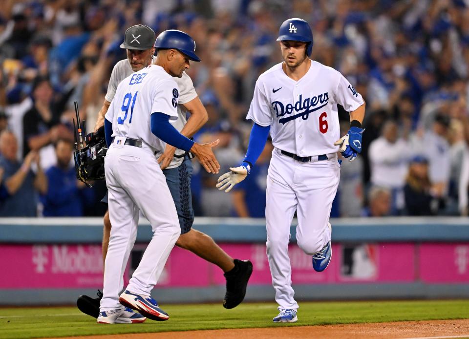 Dodgers shortstop Trea Turner rounds the bases after hitting a home run in the first inning.