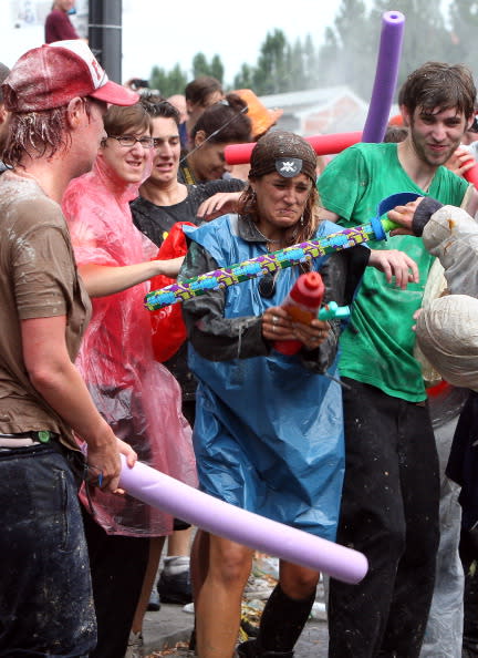 Participants fight in the the annual Vegetable Battle (Gemueseschlacht) on the Oberbaumbruecke on September 2, 2012 in Berlin, Germany. The event pits Kreuzberg district residents againts those of Friedrichshain for control of the Oberbaumbruecke (Oberbaum Bridge), and the two sides pelt each other with rotten vegetables, pet food, ketchup, chicken drumsticks, flour, water guns and styrofoam bats until one side has pushed the other from the bridge. Friedrichshain won the war, in revenge for Kreuzberg's victory the previous year. (Photo by Adam Berry/Getty Images)