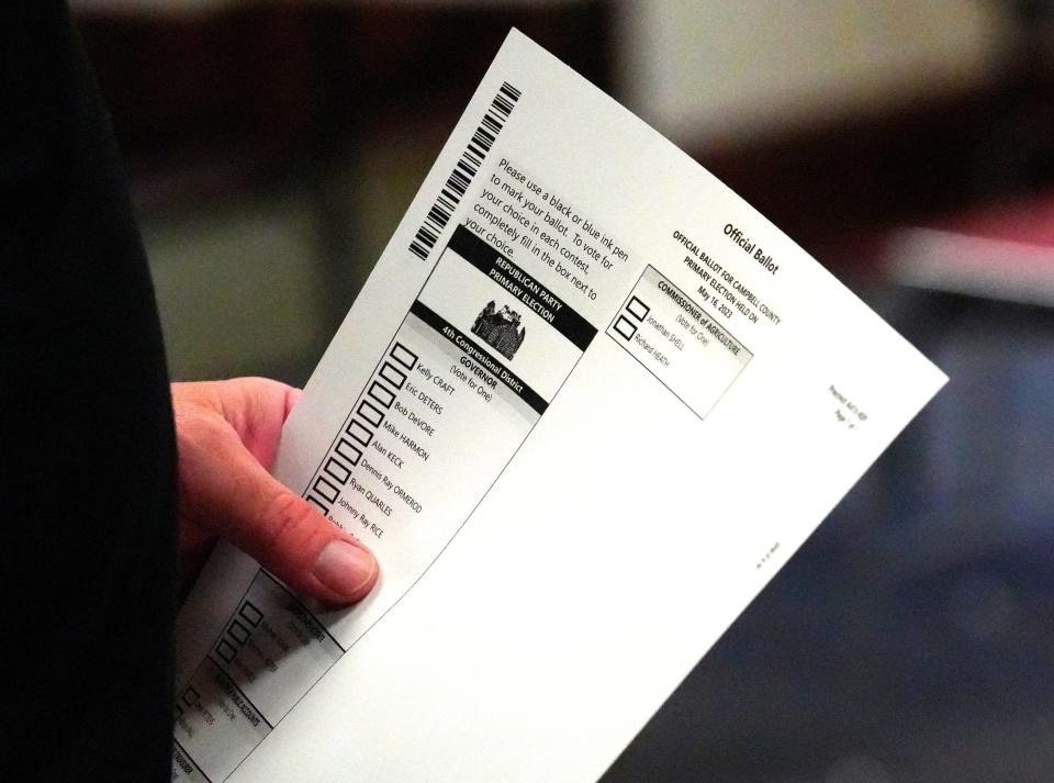 A voter holds his ballot during the Kentucky primary, Tuesday, May 16, 2023 at Campbell County Public Library in Ft. Thomas. One of the big races is for the Republican gubernatorial candidate who will likely go up against Kentucky Gov. Andy Beshear.