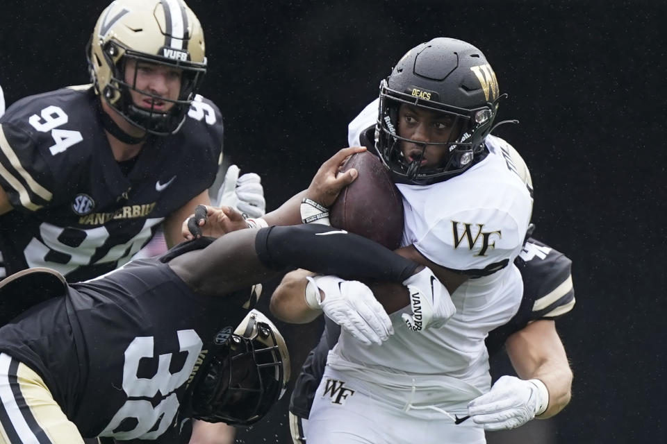 Wake Forest running back Will Towns, right, carries the ball against Vanderbilt in the second half of an NCAA college football game Saturday, Sept. 10, 2022, in Nashville, Tenn. (AP Photo/Mark Humphrey)