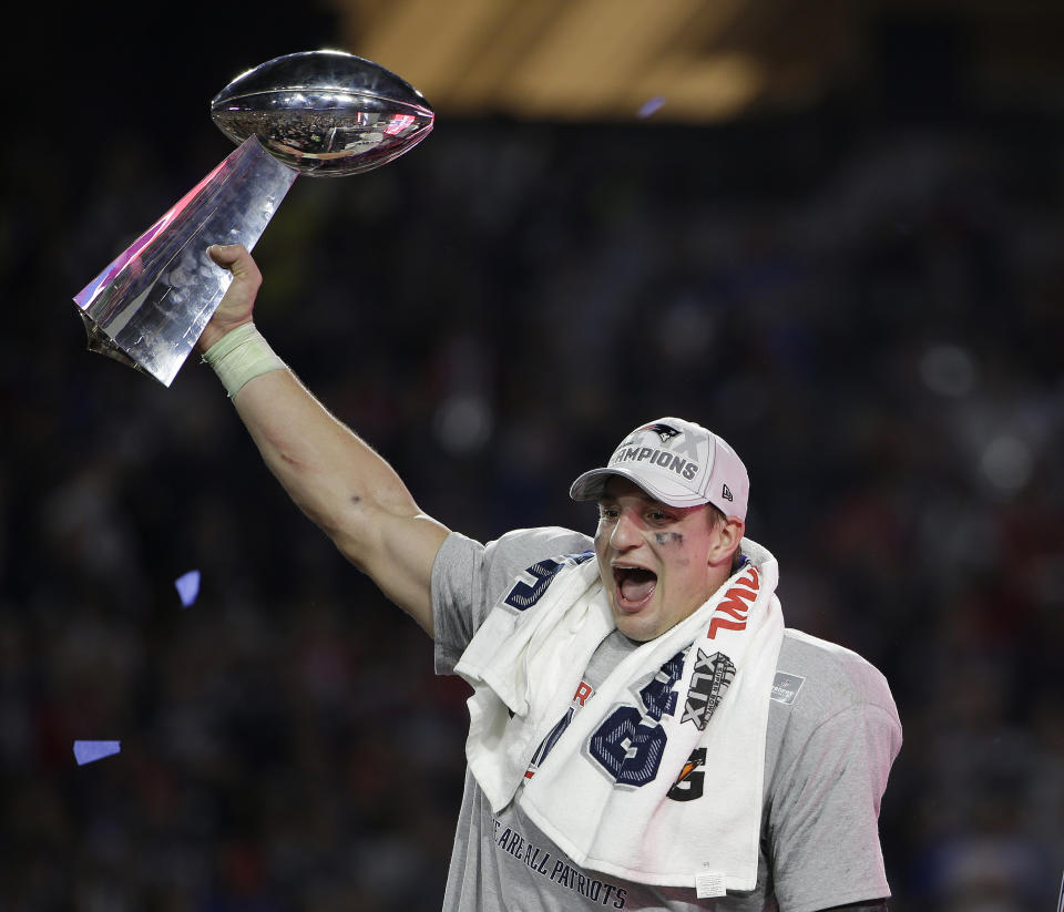 FILE - In this Feb. 1, 2015, file photo, New England Patriots tight end Rob Gronkowski celebrates after the Patriots defeated the Seattle Seahawks in the NFL Super Bowl football game in Glendale, Ariz. Gronkowski says he is retiring from the NFL after nine seasons. Gronkowski announced his decision via a post on Instagram Sunday, March 24, 2019, saying that a few months shy of this 30th birthday “its time to move forward and move forward with a big smile.” (AP Photo/Matt Rourke, File)