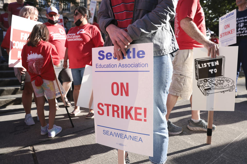 Teachers from Seattle Public Schools picket outside Roosevelt High School on what was supposed to be the first day of classes, Wednesday, Sept. 7, 2022, in Seattle. The first day of classes at Seattle Public Schools was cancelled and teachers are on strike over issues that include pay, mental health support, and staffing ratios for special education and multilingual students. (AP Photo/Jason Redmond)