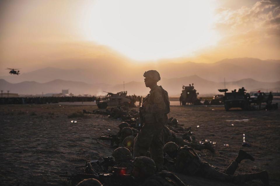 This U.S. Marine Corps photo released on Aug. 18, 2021, shows US Army soldiers assigned to the 10th Mountain Division providing security at Hamid Karzai International Airport, Kabul, Afghanistan, on Aug. 16, 2021. Soldiers and Marines are assisting the State Department with a drawdown of designated personnel in Afghanistan.