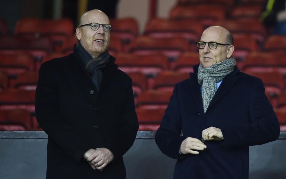 Avram Glazer (L) and Joel Glazer, the Co-Chairmen of Manchester United look on during the Barclays Premier League match between Manchester United and Burnley at Old Trafford on February 11, 2015 - Getty Images/Michael Regan