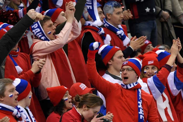 Rowdy Russian fans in the stands get behind their team in the tense politically-charged atmosphere