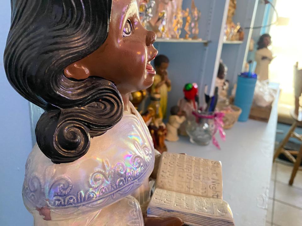 Angel figurines and statues adorn the shelves and walls of Peggy's Heavenly Soul Food on South Cleveland Street.