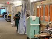 A medical worker wears protective clothing in the Intensive Care Unit (ICU) of St John's Regional Medical Center in Oxnard