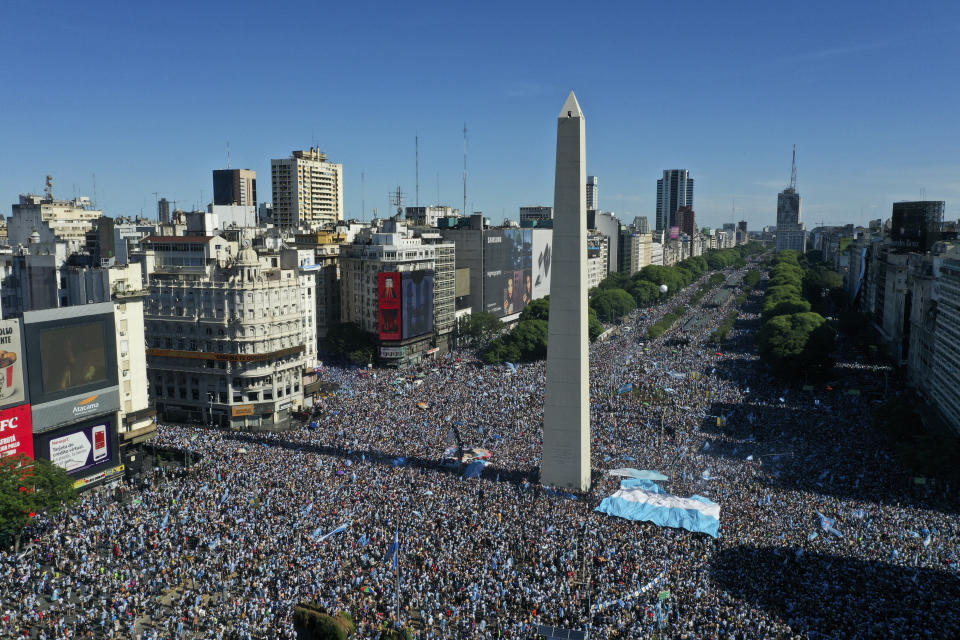 Argentine soccer fans celebrate their team's World Cup victory over France in Buenos Aires, Argentina, Sunday, Dec. 18, 2022. (AP Photo/Gustavo Garello)