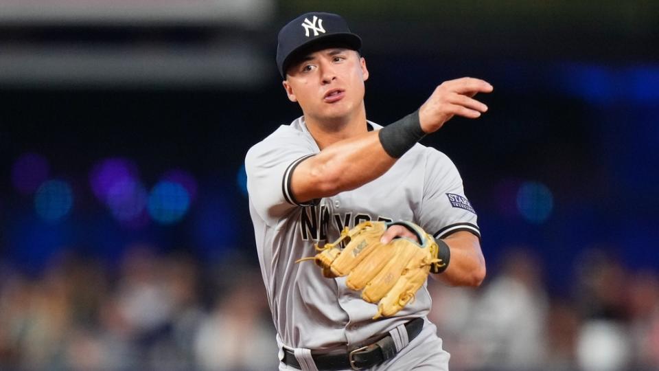 Aug 12, 2023; Miami, Florida, USA; New York Yankees shortstop Anthony Volpe (11) throws the ball to first base for an out against the Miami Marlins during the eighth inning at loanDepot Park.