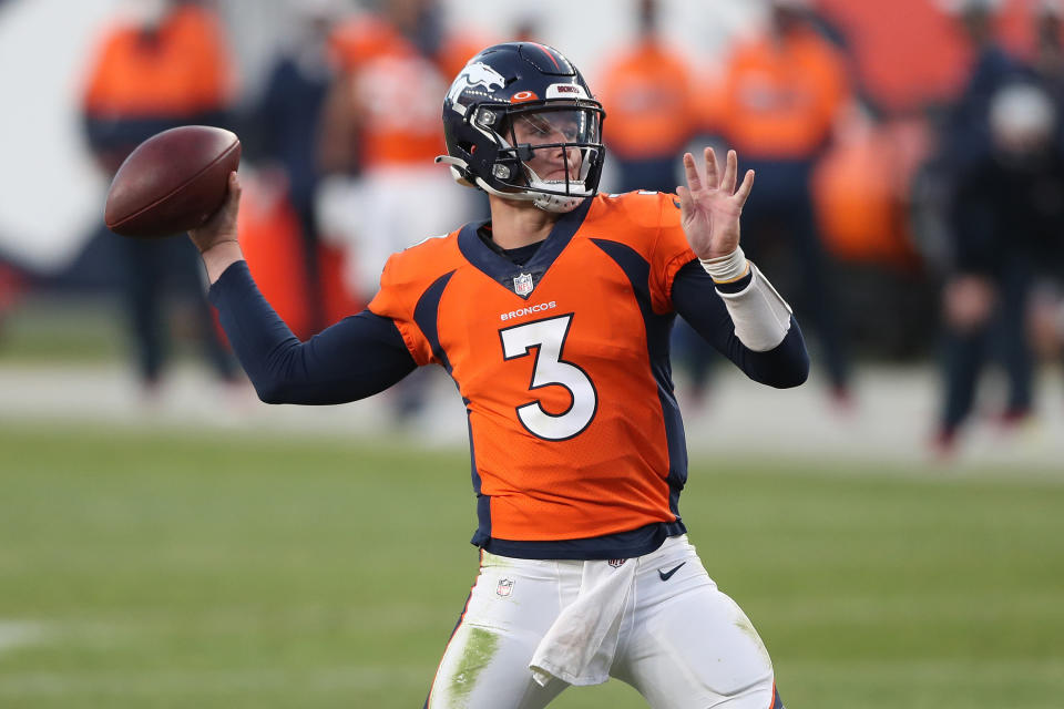 Broncos uniform with blue helmet and orange jersey